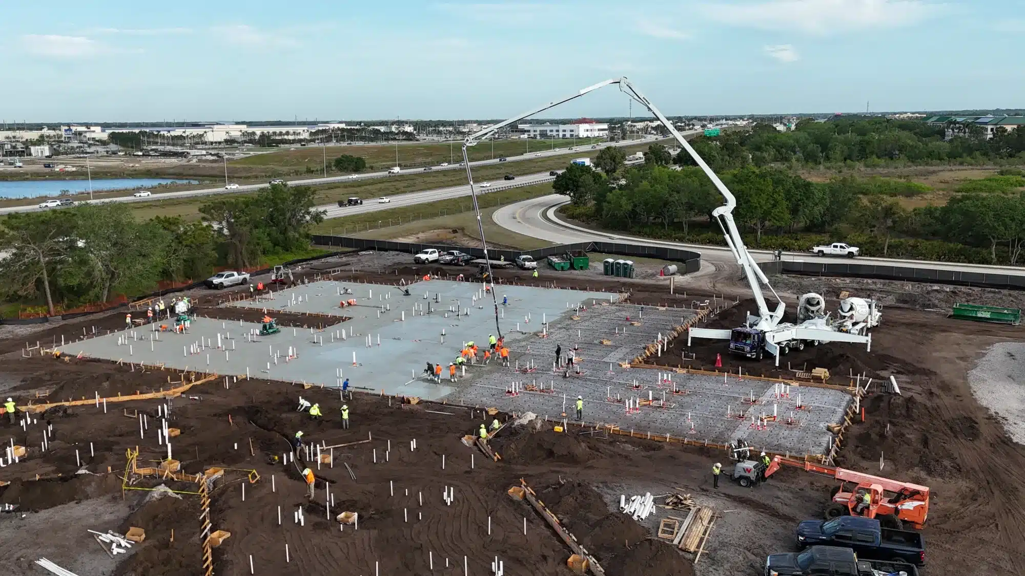 Aerial view of a Southwest Structural commercial building pad pour with pump truck