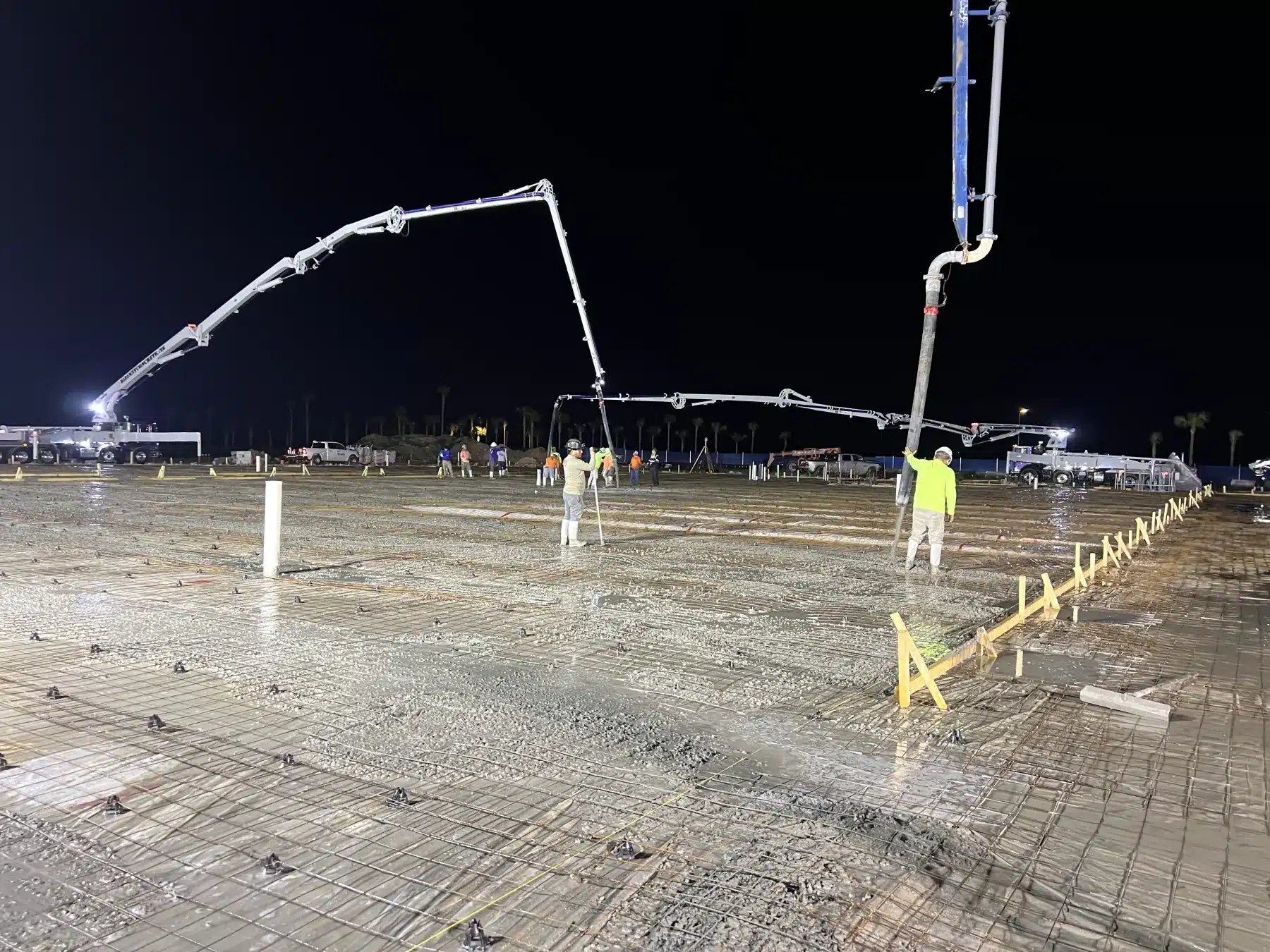 Night concrete slab pour with pump trucks on a Southwest Structural project