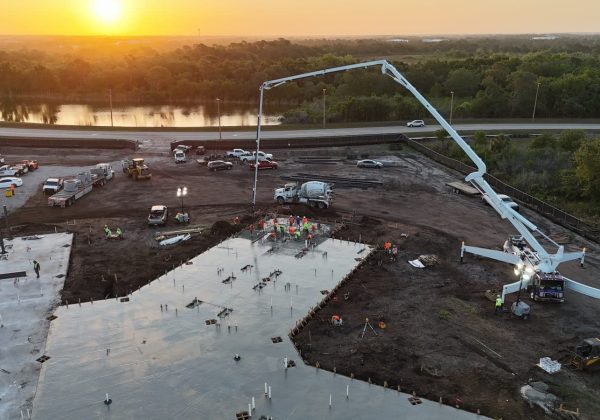 Golden-hour commercial concrete pour with a pump truck in South Florida